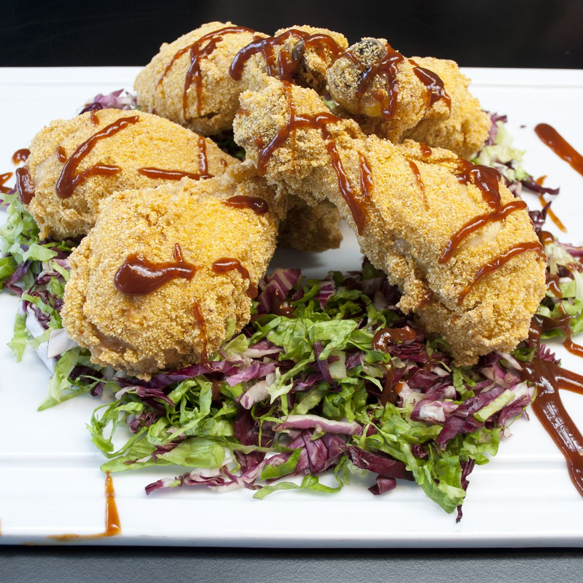 Fusi di pollo in crosta di mais bianco in salsa barbeque